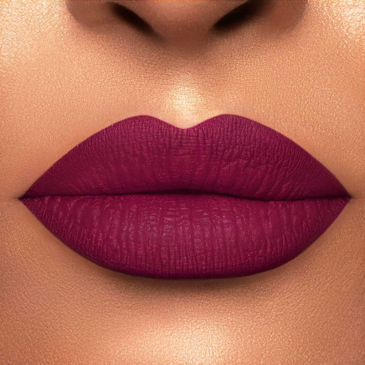 This is a light skin tone lip swatch of the Berry Me Liquid Matte Lip.