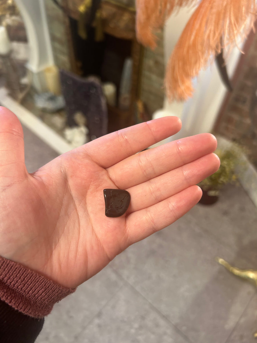 Onyx Tumbler in the palm of a hand