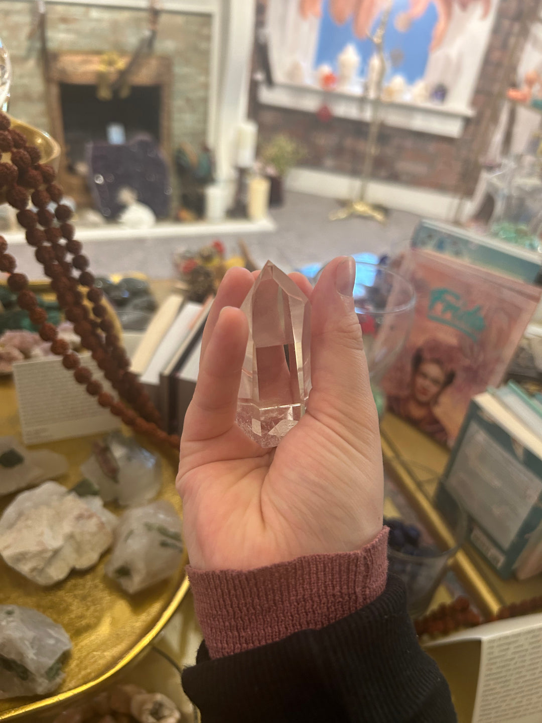 Mini Clear Quartz Point with a hand around
