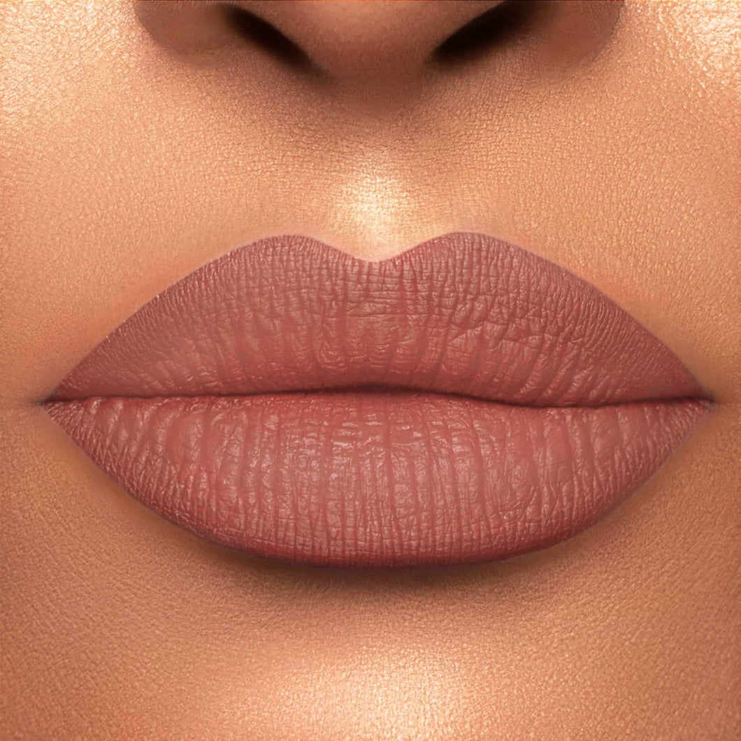 This is a light skin tone lip swatch of the Truffle Liquid Matte Lip.
