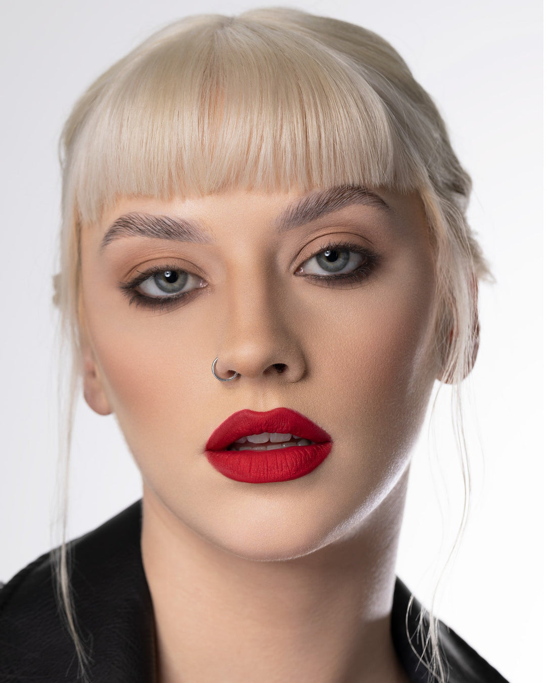 A model wearing the Twin Flame Velvet Mousse Lipstick.