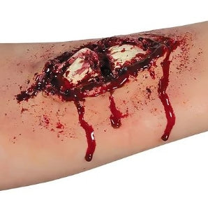 Artificial wound with blood on a white background