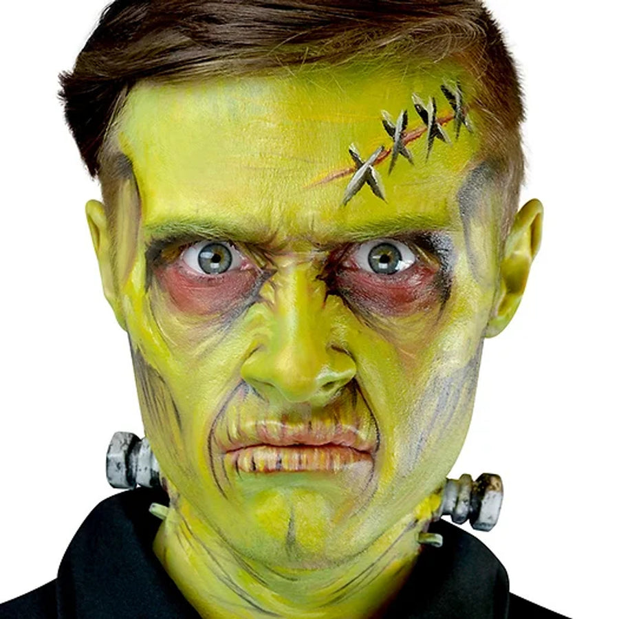 Person with green face paint and barbed wire on a white background