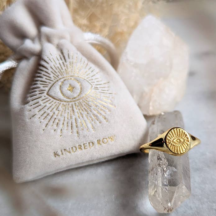 Evil Eye Adjustable Gold Ring around  a quartz with a velvet bag