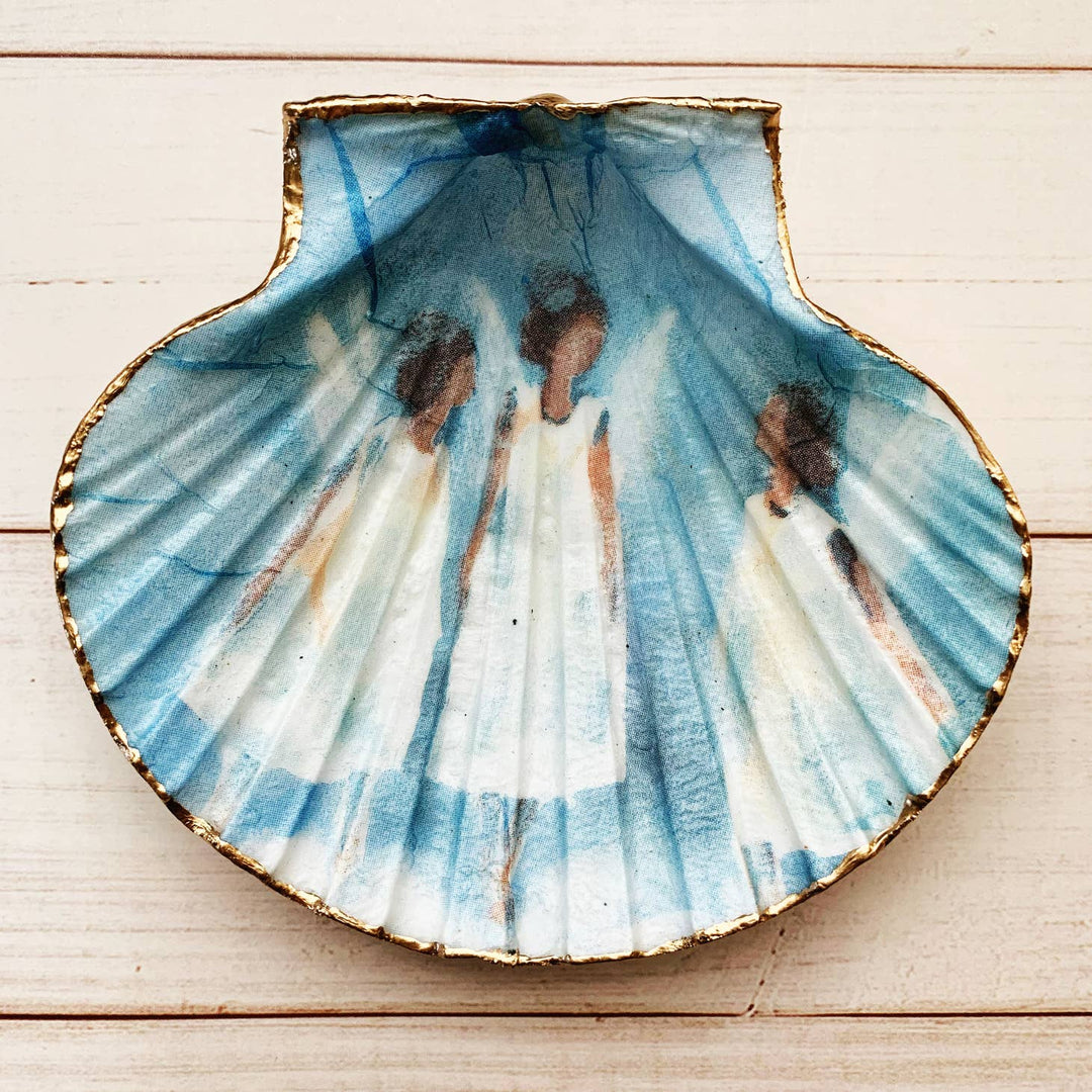 Hand painted shell with a blue background and white angels.