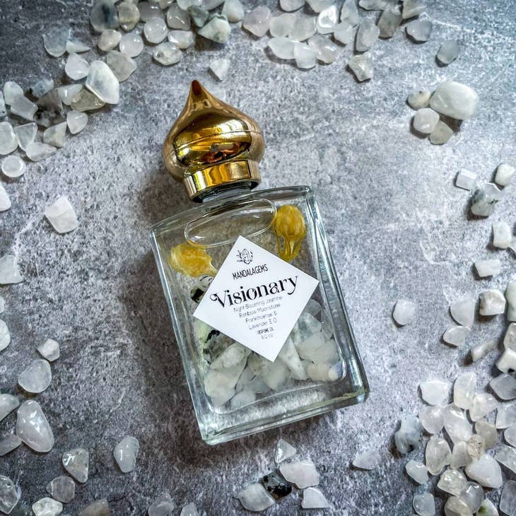 Jasmine Perfume Oil with Rainbow Moonstone crystals with Moonstone crystals around it