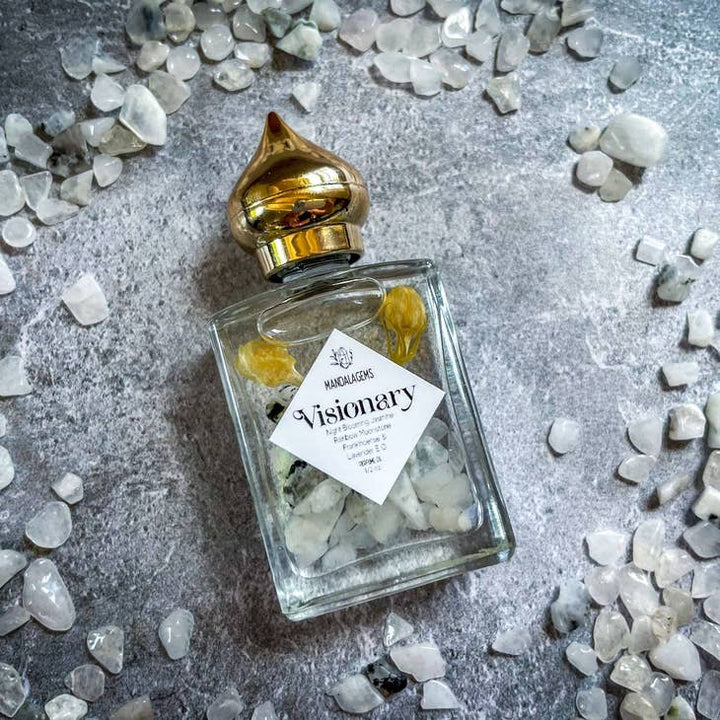 Jasmine Perfume Oil with Rainbow Moonstone crystals with Moonstone crystals around it