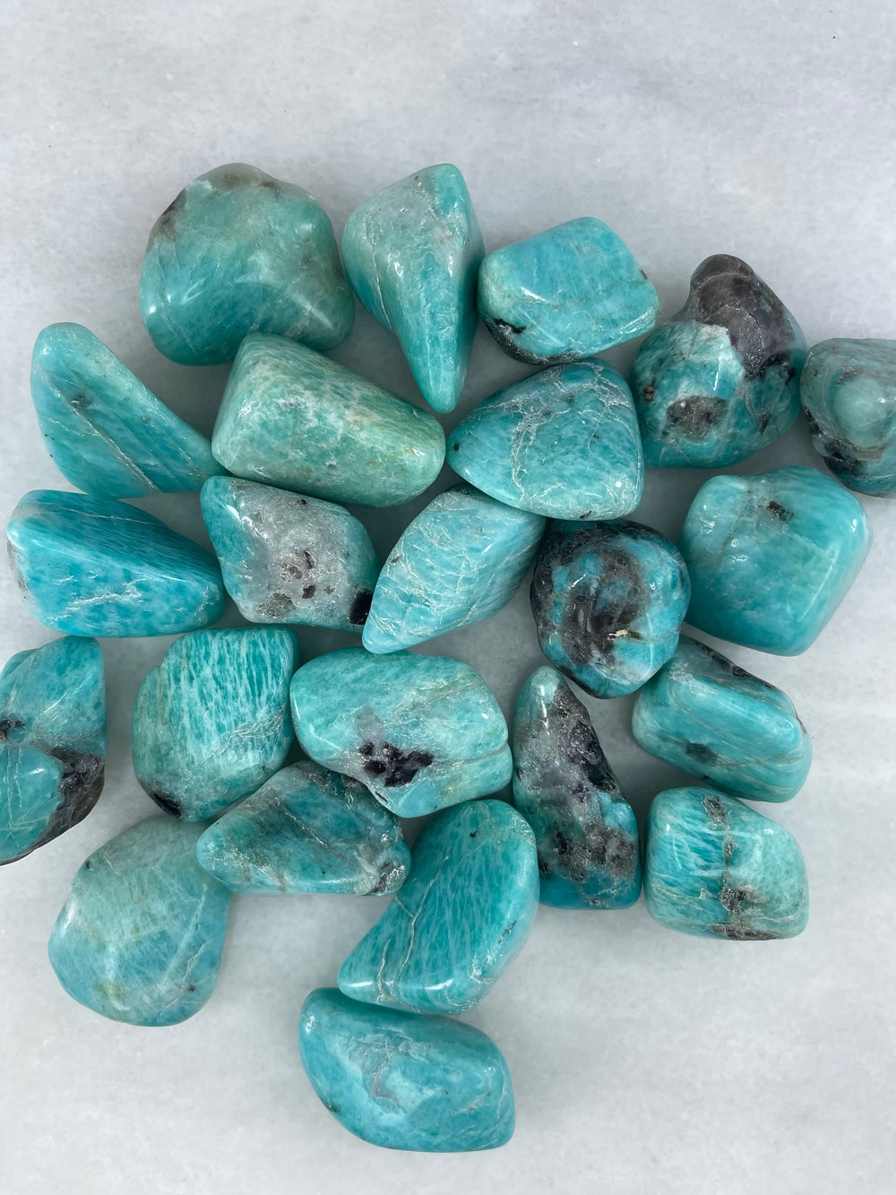 multiple amazonite tumblers together