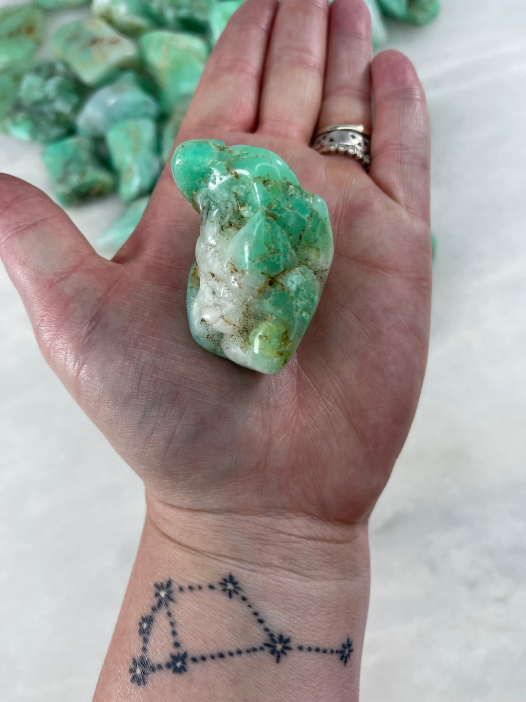 Holding the Chrysoprase Raw Palm Stone