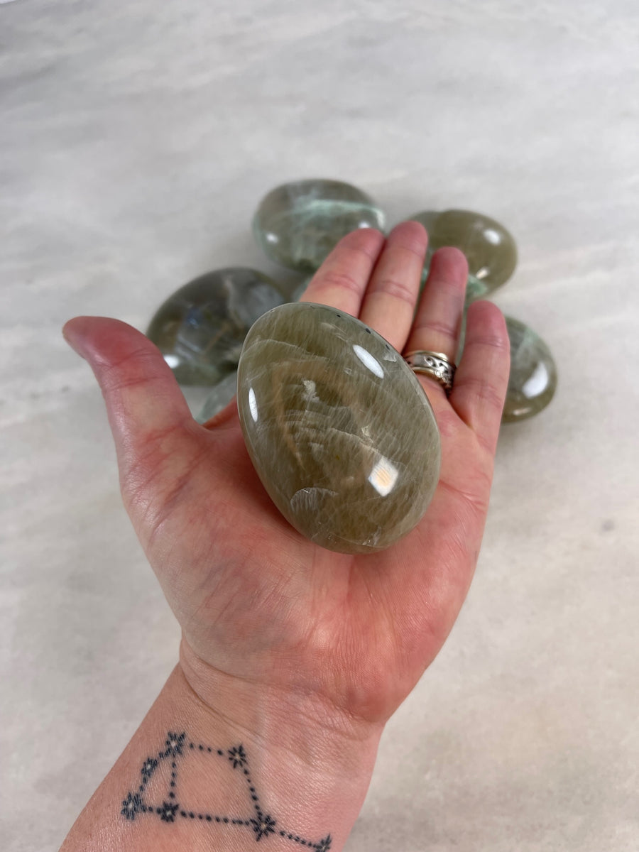 Garnierite Palm Stone holding a palm stone