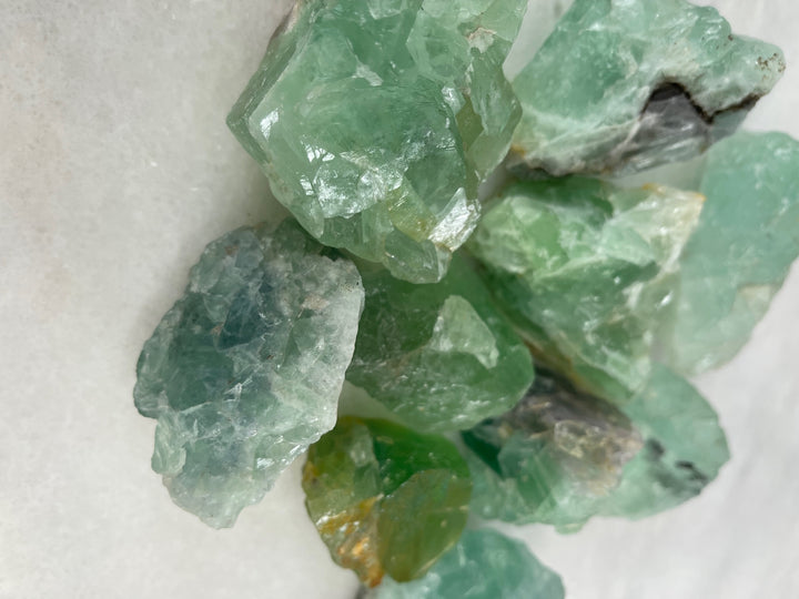 Raw Fluorite Palm Stones close up