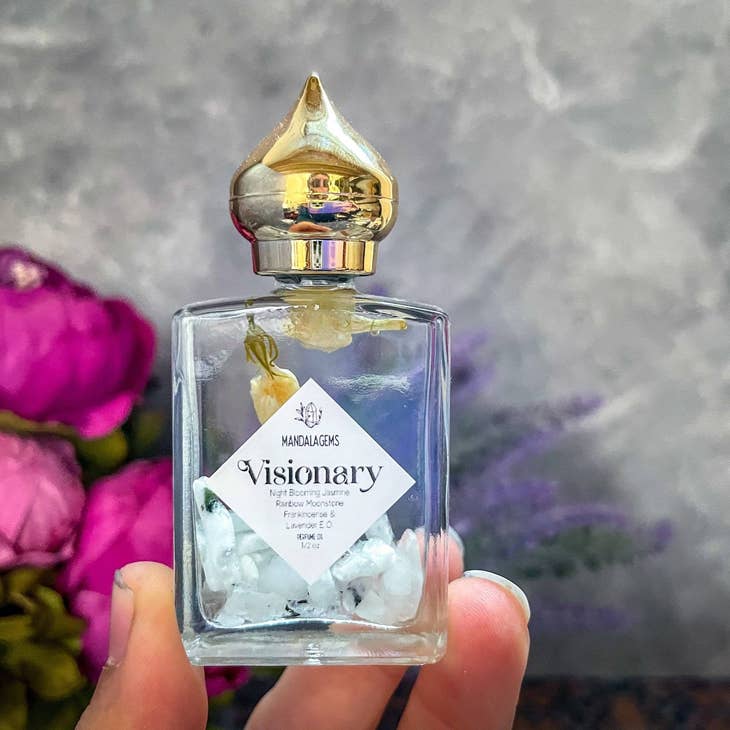 Close up Jasmine Perfume Oil with Rainbow Moonstone crystals