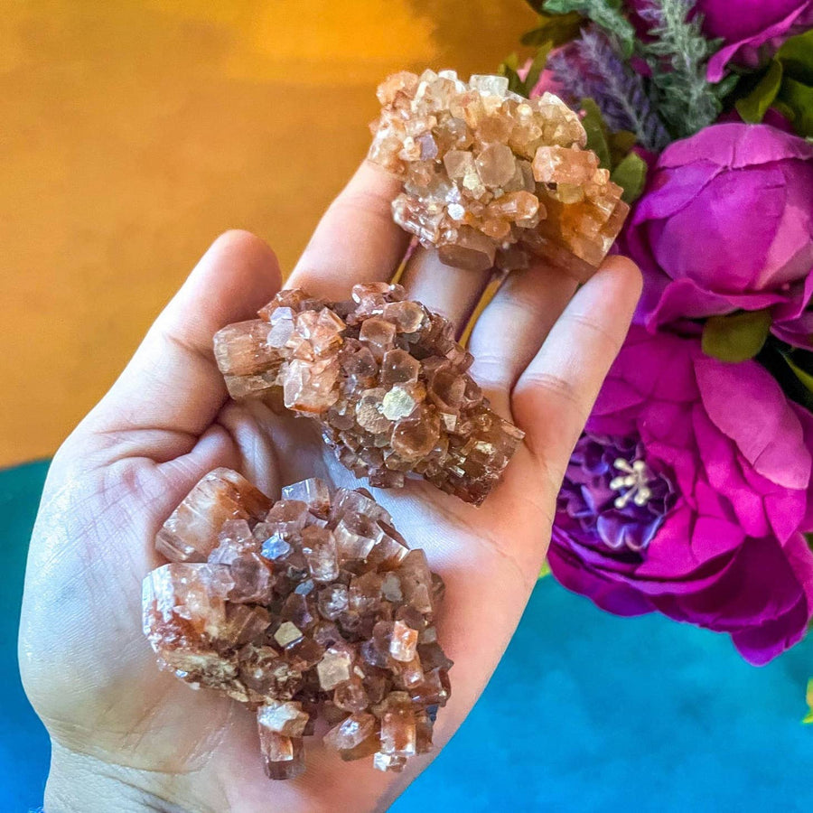 Aragonite Crystal Clusters in the palm of a hand