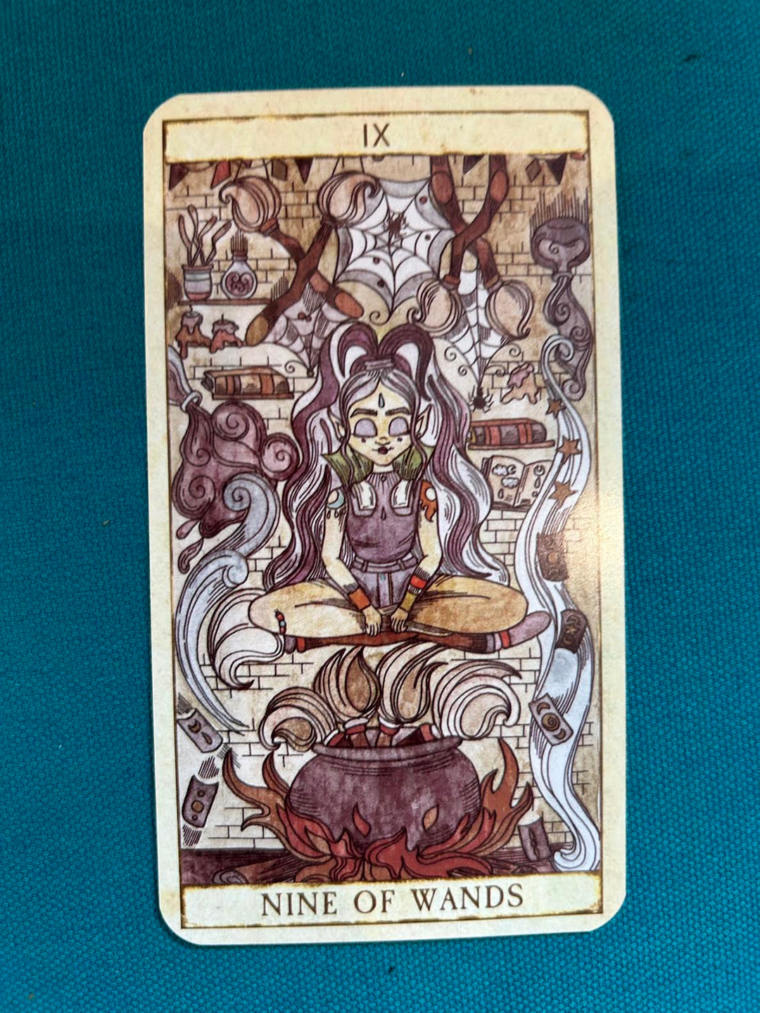 This is a card in the deck of tarot of spells and potions. It is a women doing kitchen witchery. 