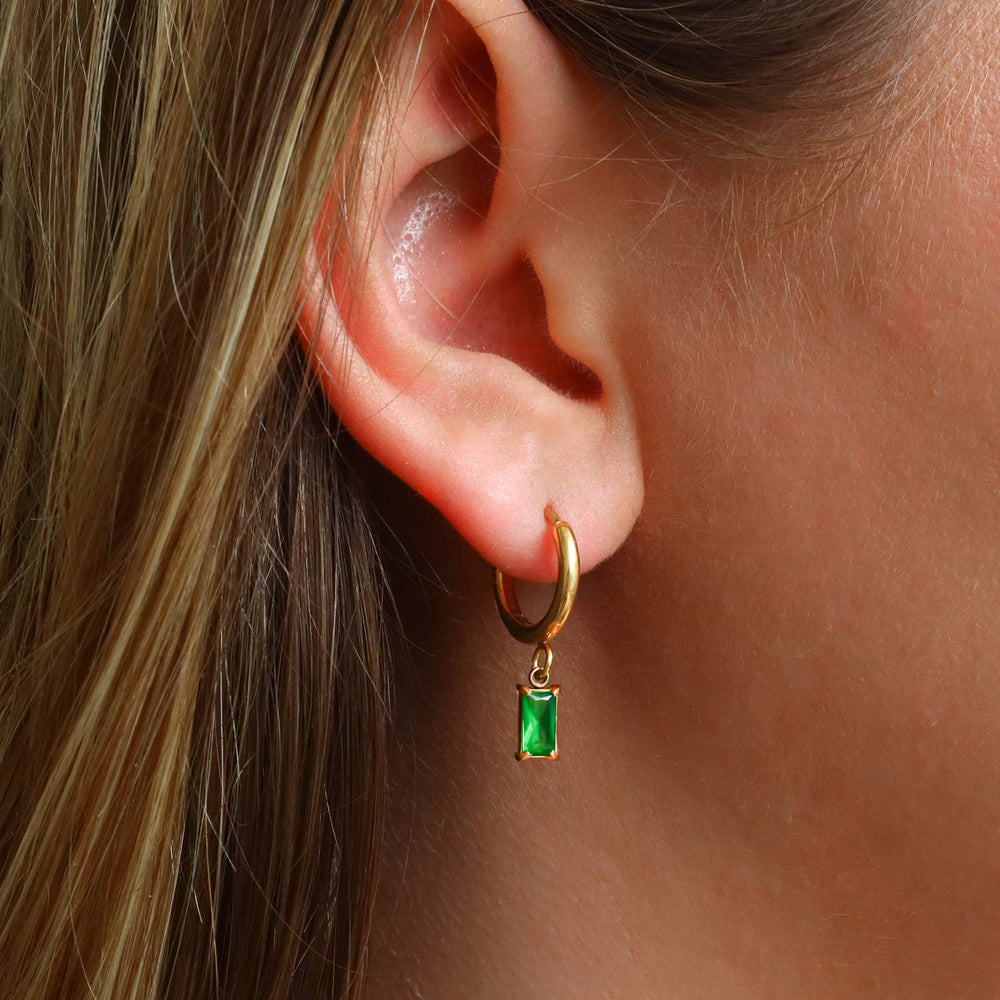 Emerald Dangle Earrings  on a model