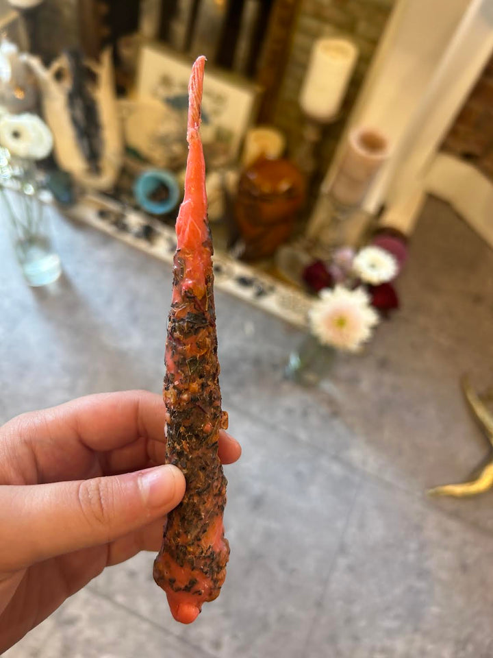 This is the orange intention candle made by a witch up in Latvia.