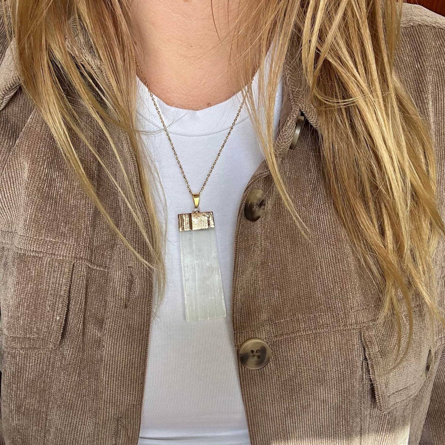 Someone wearing the Selenite Bar Necklace