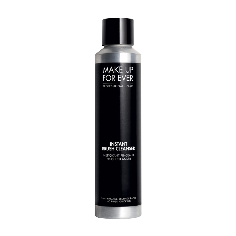 Makeup brush cleanser bottle with black and silver design on a white background