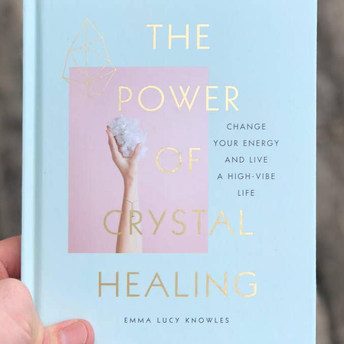 Someone holding The Power of Crystal Healing