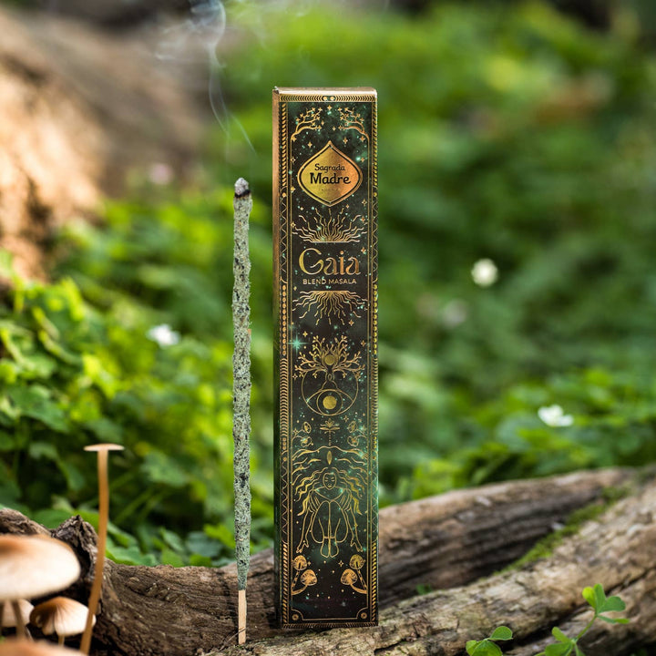 Gaia Incense with a stick burning next to the box