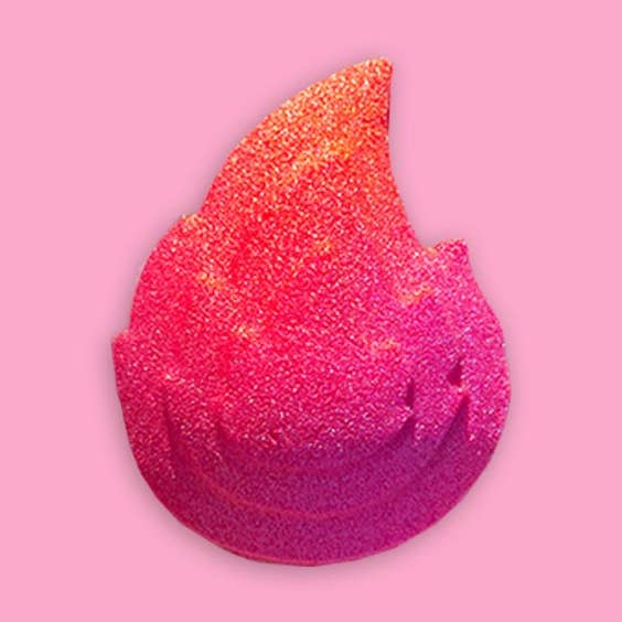 This is the pink, red, and orange glittery twin flame bath bomb with a red tigers eye crystal tumbler inside.