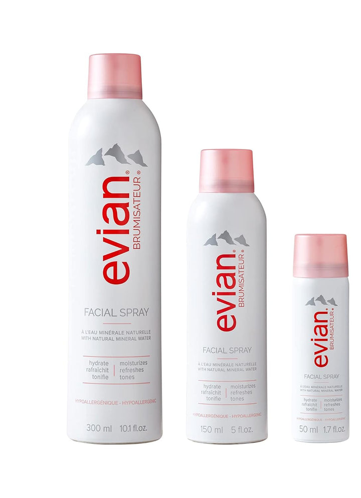 Evian facial spray bottles of different sizes on a white background