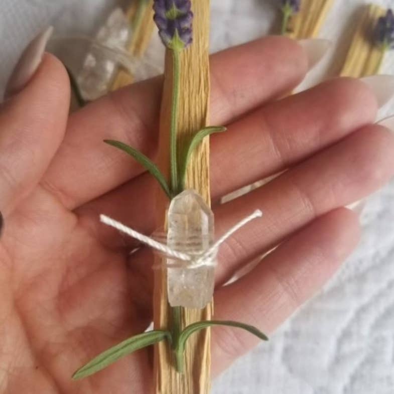 close up Palo santo stick with lavender and quartz