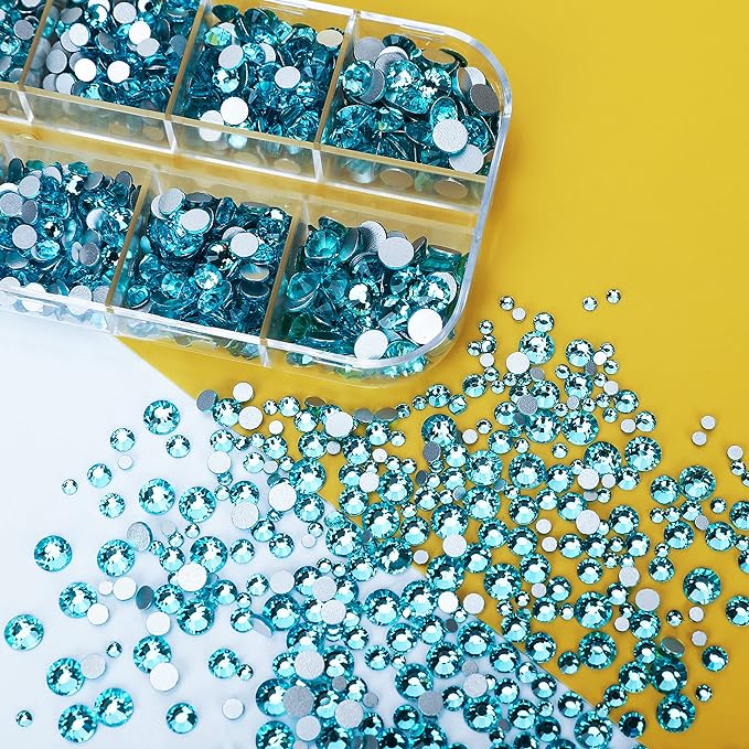 Aquamarine Rhinestones in their case and spilling out