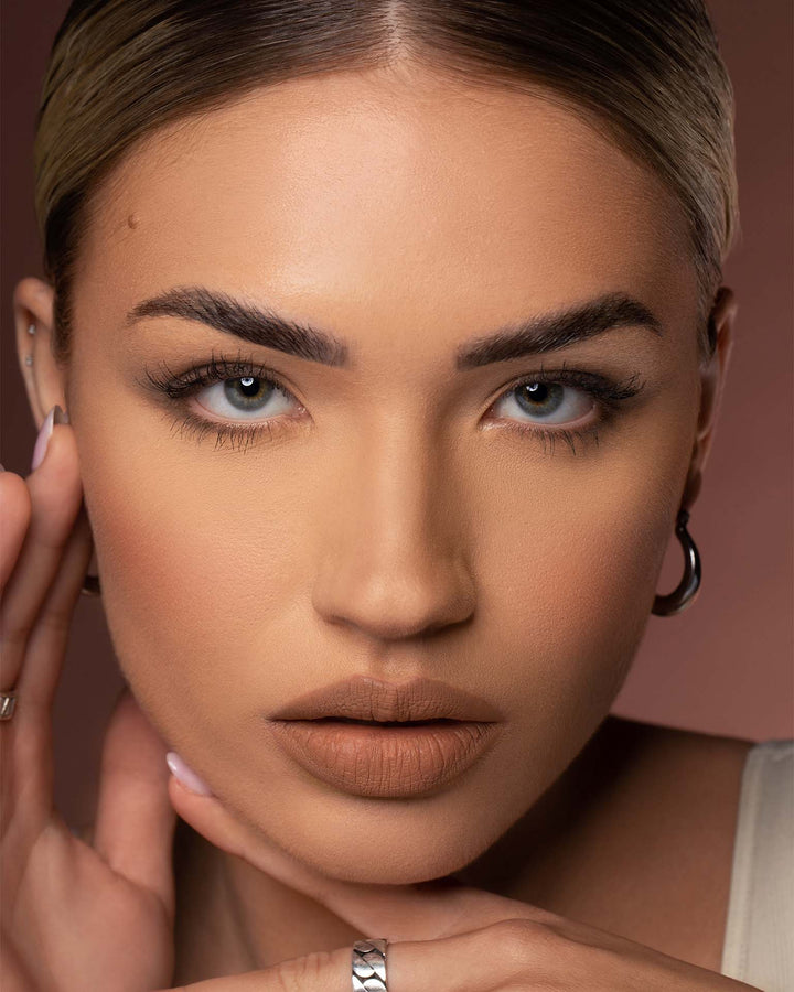 This is another picture with the Always Late Velvet Mousse Lip Duo on a person showing what it looks like against another skin tone and a full face