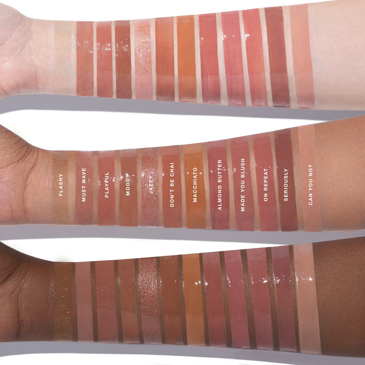 These are swatches of all the dose of color lip glosses on three different skin tones. The middle has the name of each color for all the skin tones