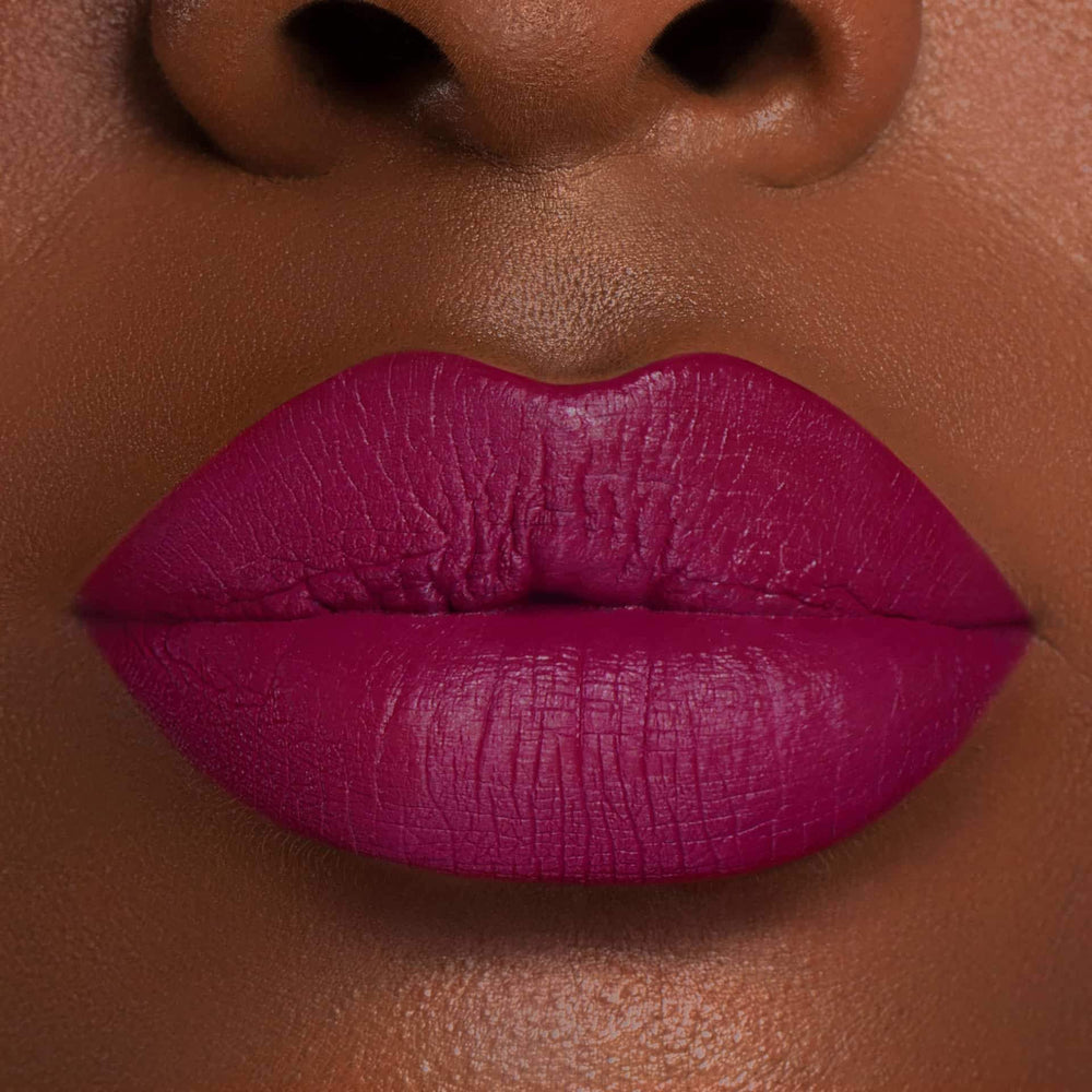 This is a dark skin tone lip swatch of the Berry Me Liquid Matte Lip.