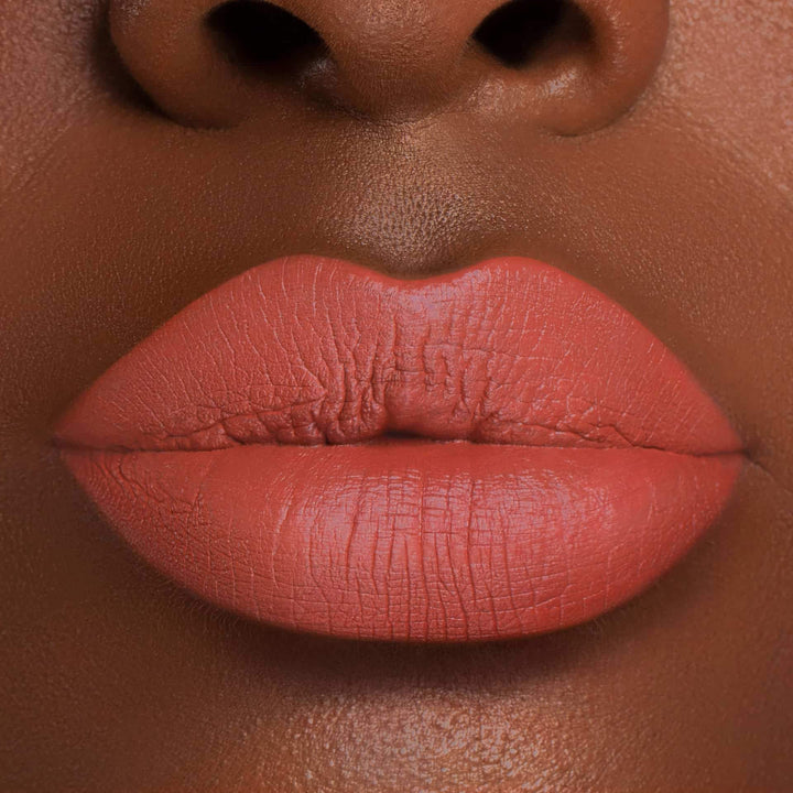 This is a dark skin tone lip swatch of the Campfire Liquid Matte Lip.