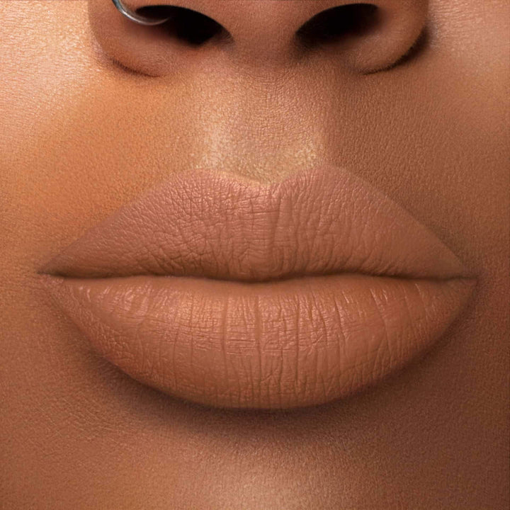 This is a medium skin tone lip swatch of the Catching Feelings Liquid Matte Lip.