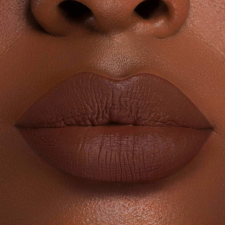 This is a dark skin tone lip swatch of the Chocolate Wasted Liquid Matte Lip.