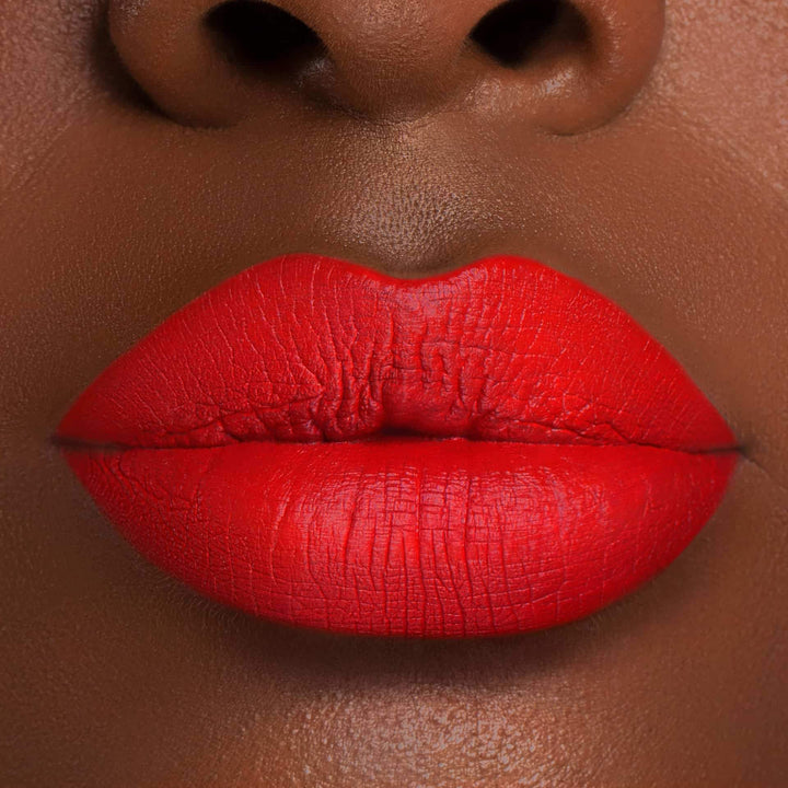 This is a darker skin tone lip swatch of the Coral Crush Liquid Matte Lip.