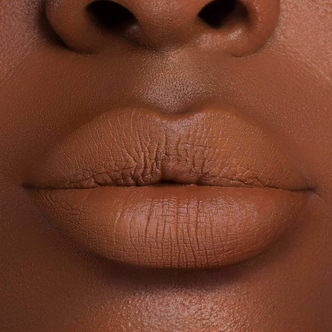 This is a dark skin tone lip swatch of the Cork Liquid Matte Lip.