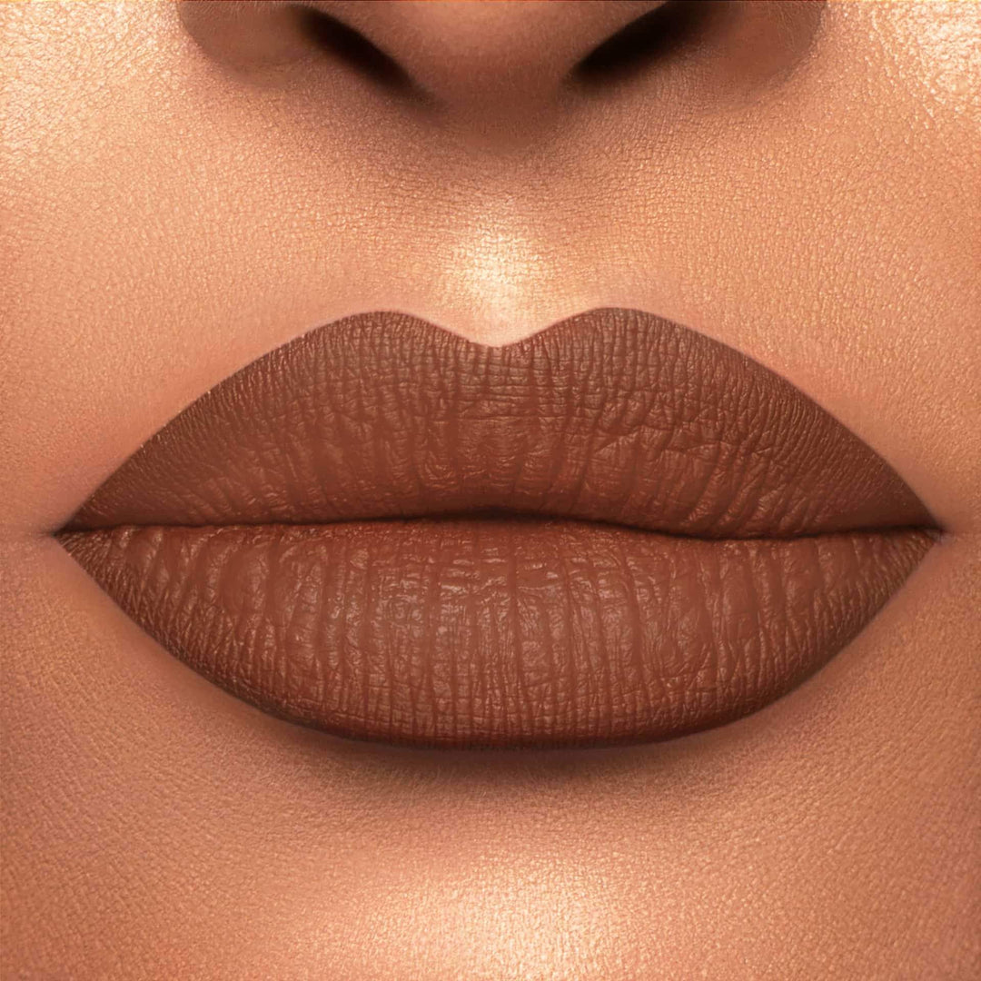 This is a light skin tone lip swatch of the Cork Liquid Matte Lip.