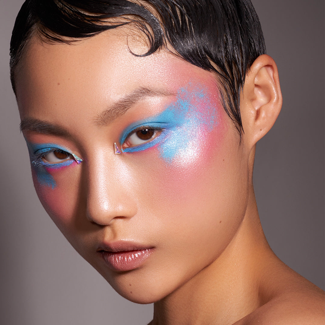 This is a model with a pink and blue eye shadow look. The blue is the colorfix matte beaches shade.