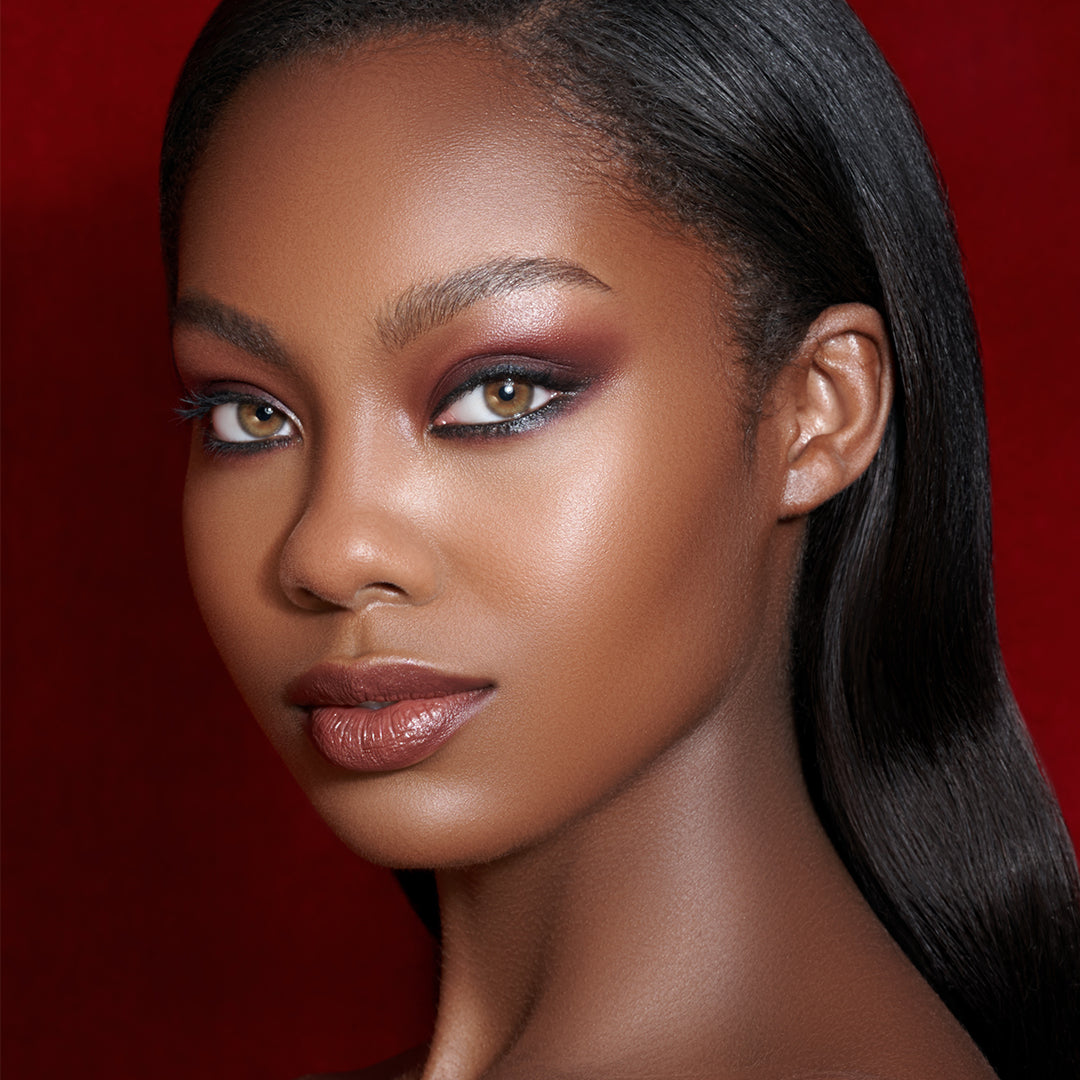 This is a model with the colorfix matte chocolate shade under her eyes and on her lips
