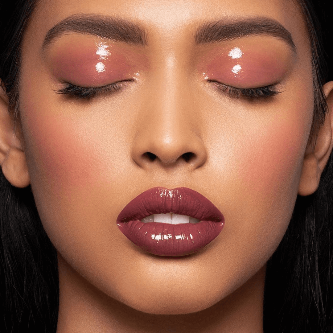 This is a model wearing the desert rose shade of the color fix mattes with a clear glaze on top of the lips and eyes. She is wearing this shade as blush, eye shadow and lipstick.