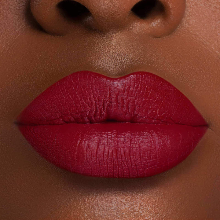 This is a dark skin tone lip swatch of the Extra Saucy Liquid Matte Lip.