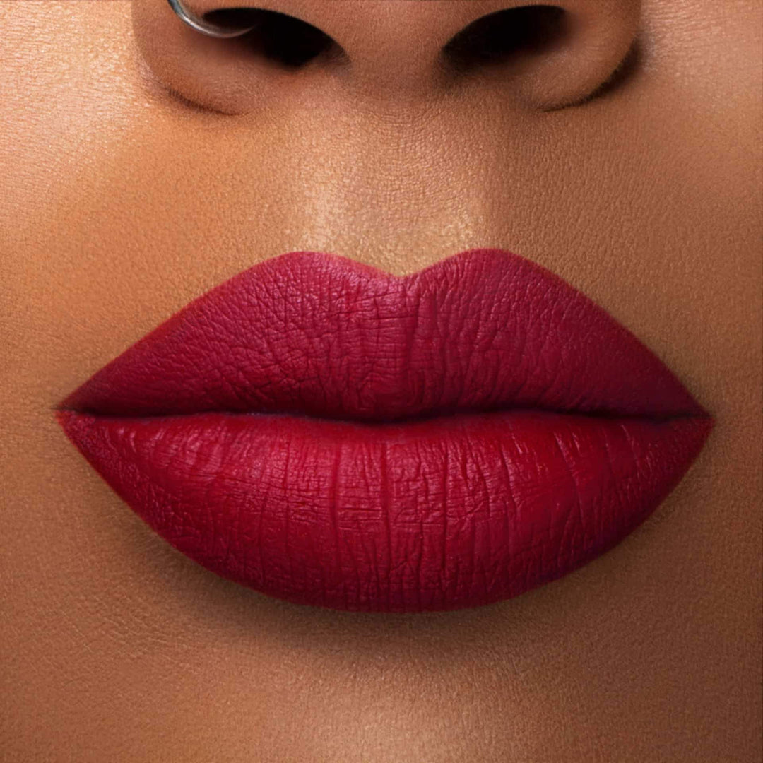 This is a medium skin tone lip swatch of the Extra Saucy Liquid Matte Lip.