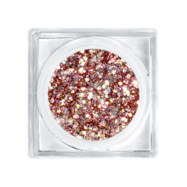 Rose gold glitter in a small transparent container on a white background