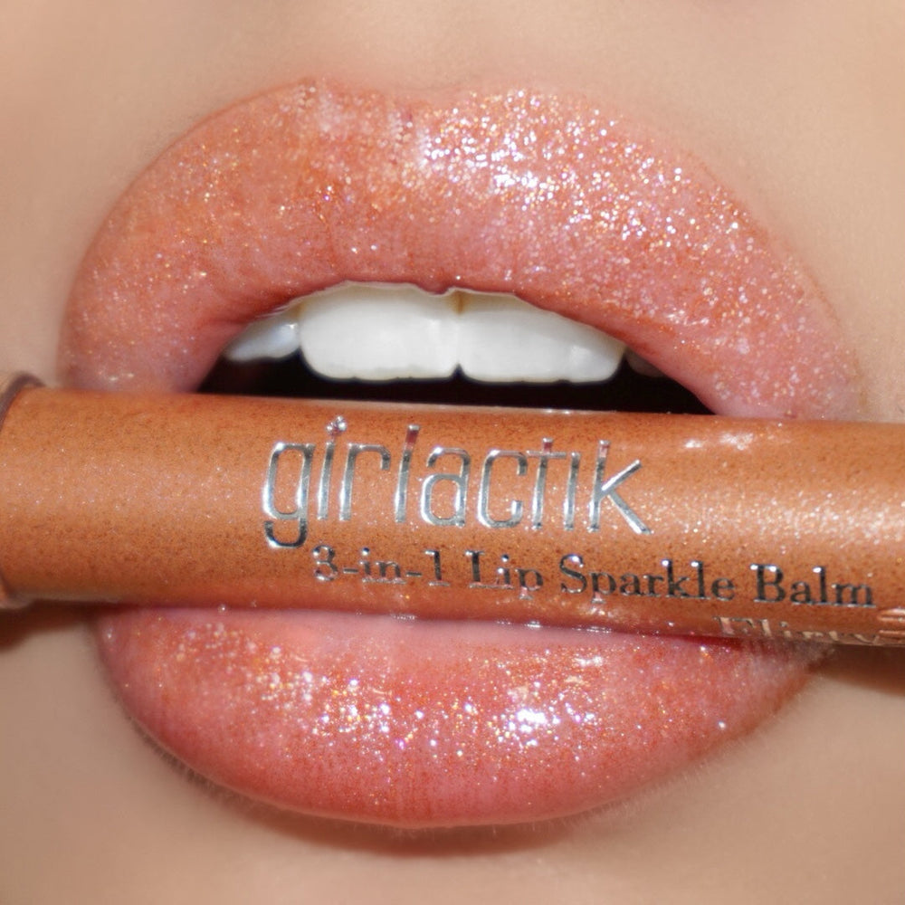 Flirty 3 in 1 Sparkle Balm on the lips holding the pencil