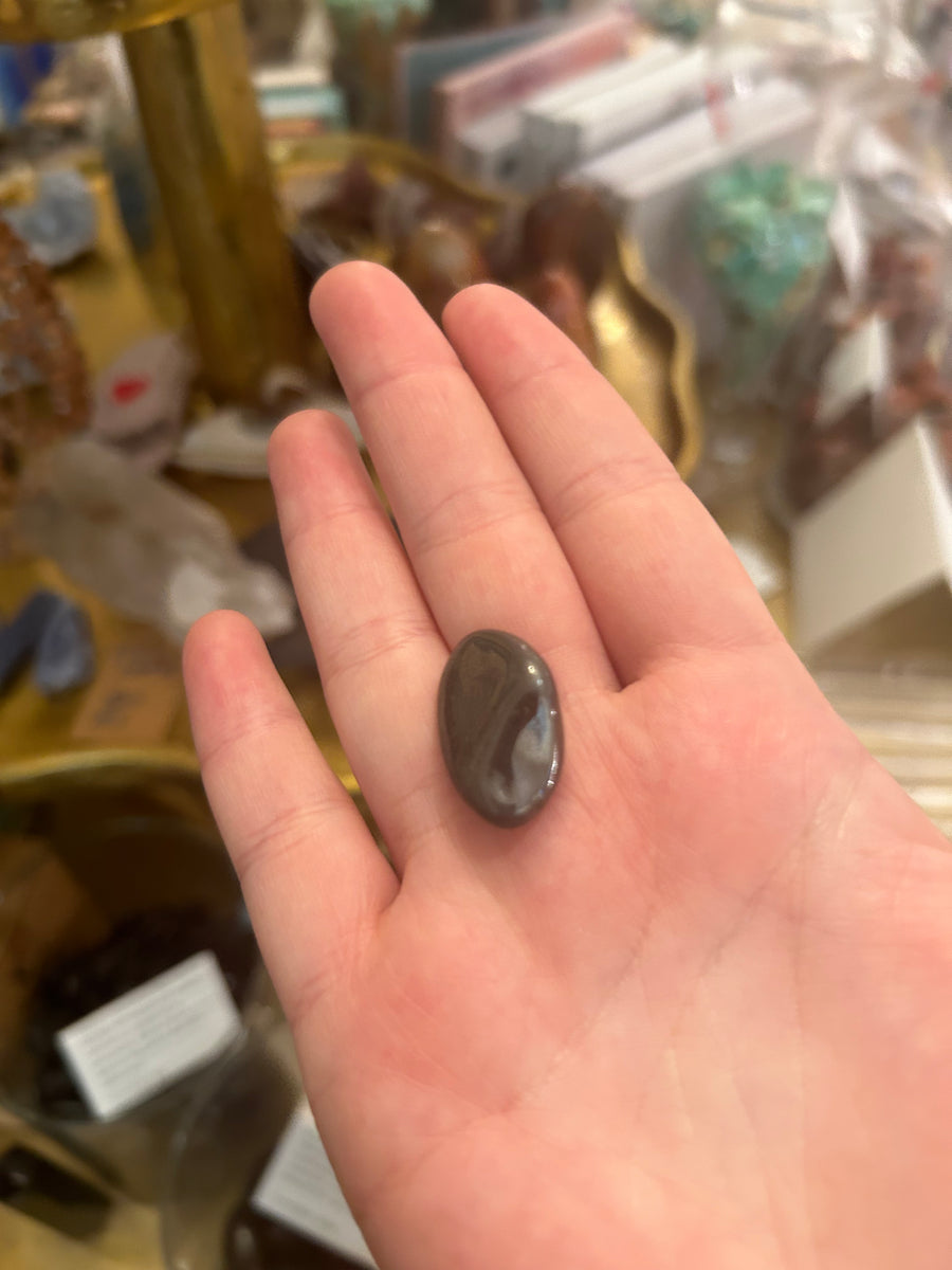Hematite Tumbler in palm of hand 