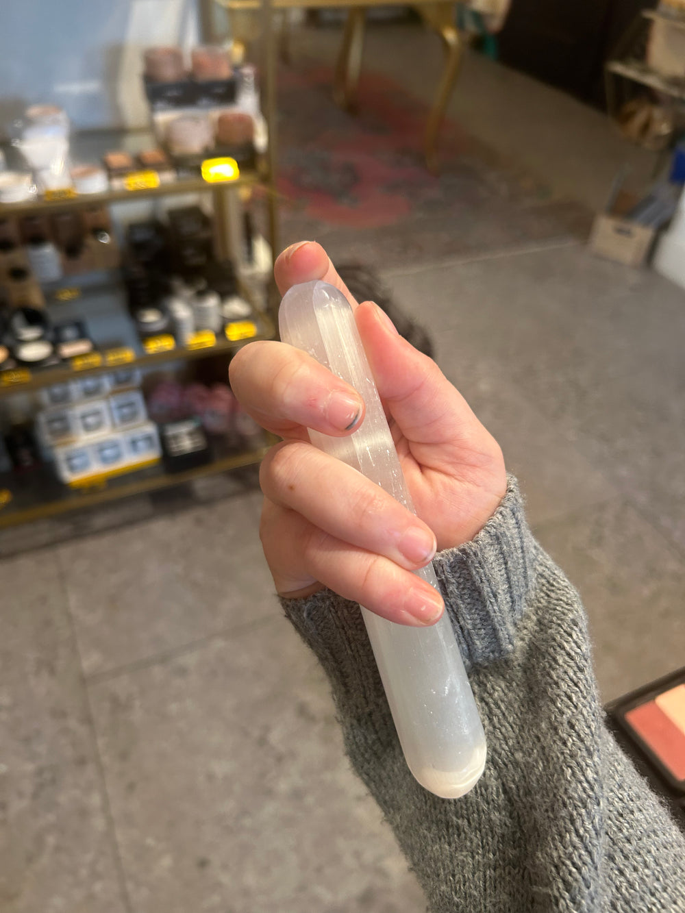Selenite Cylinder Wands upright in a hand