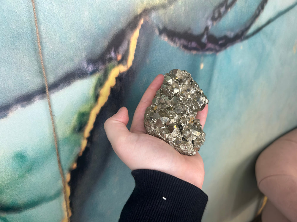Large Pyrite Cluster in the palm of a hand