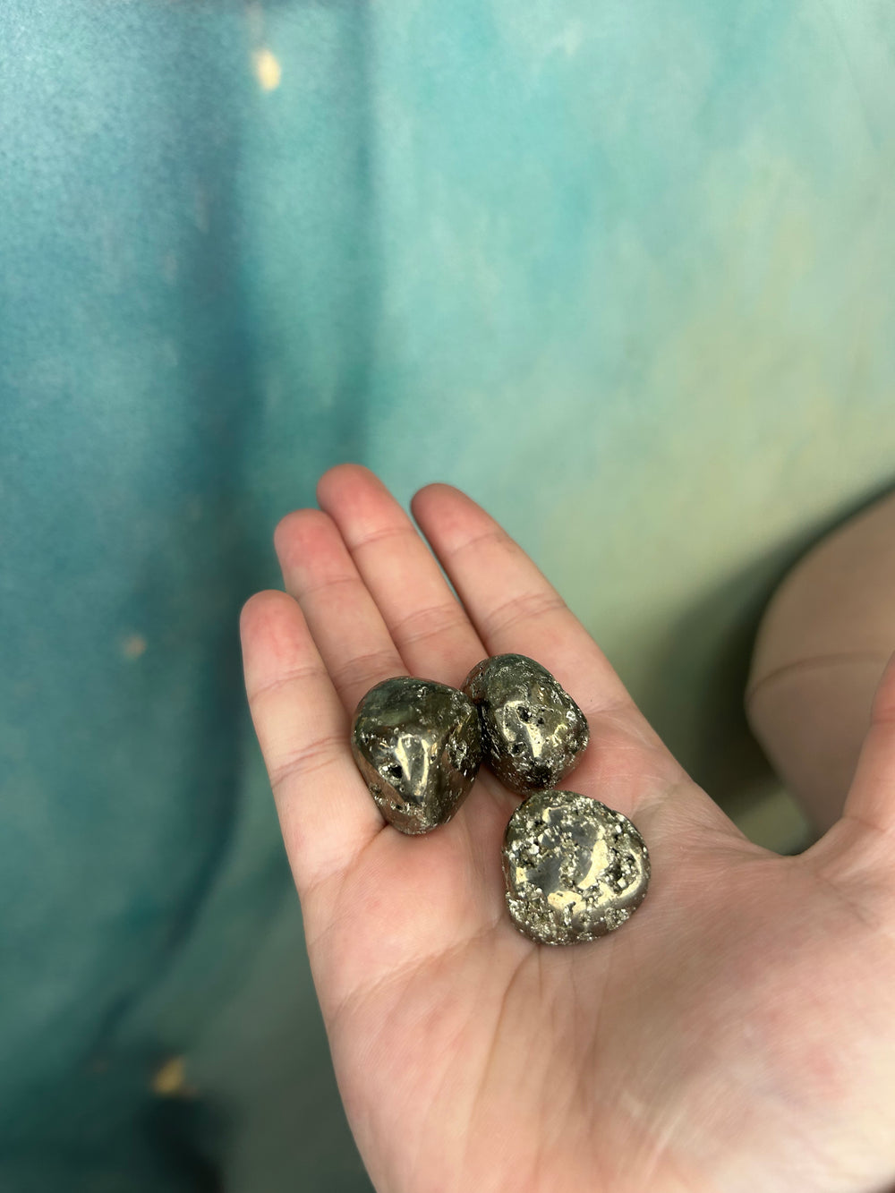 Pyrite Tumblers in the palm of my hand