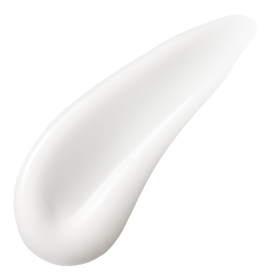 Close-up of a smooth, white cream texture on a white background
