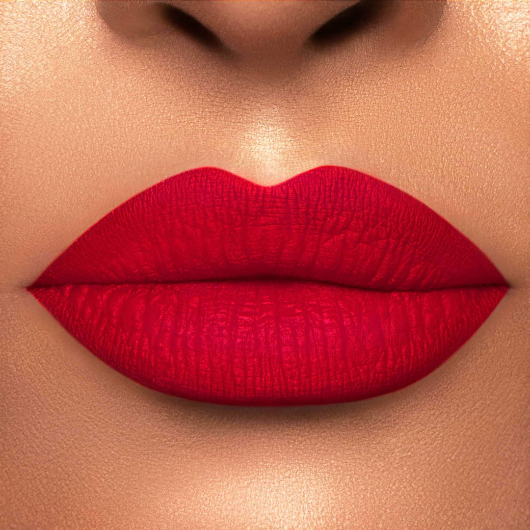 This is a light skin tone lip swatch of the Kiss of Fire Liquid Matte Lip.